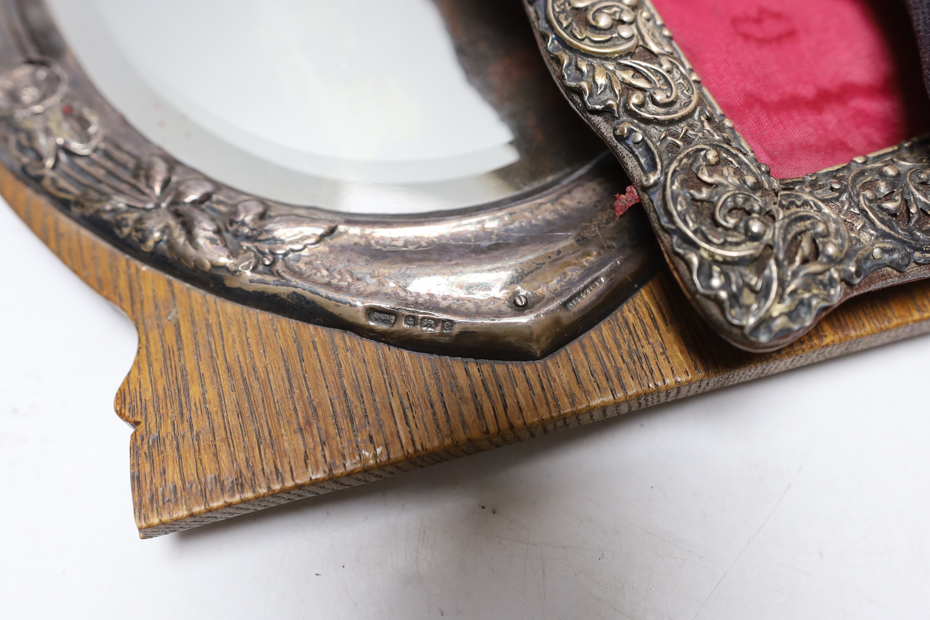 An Edwardian silver mounted wooden easel mirror, Birmingham, 1904, 31.4cm (a.f.), together with three assorted silver mounted photograph frames, earliest Birmingham, 1900.